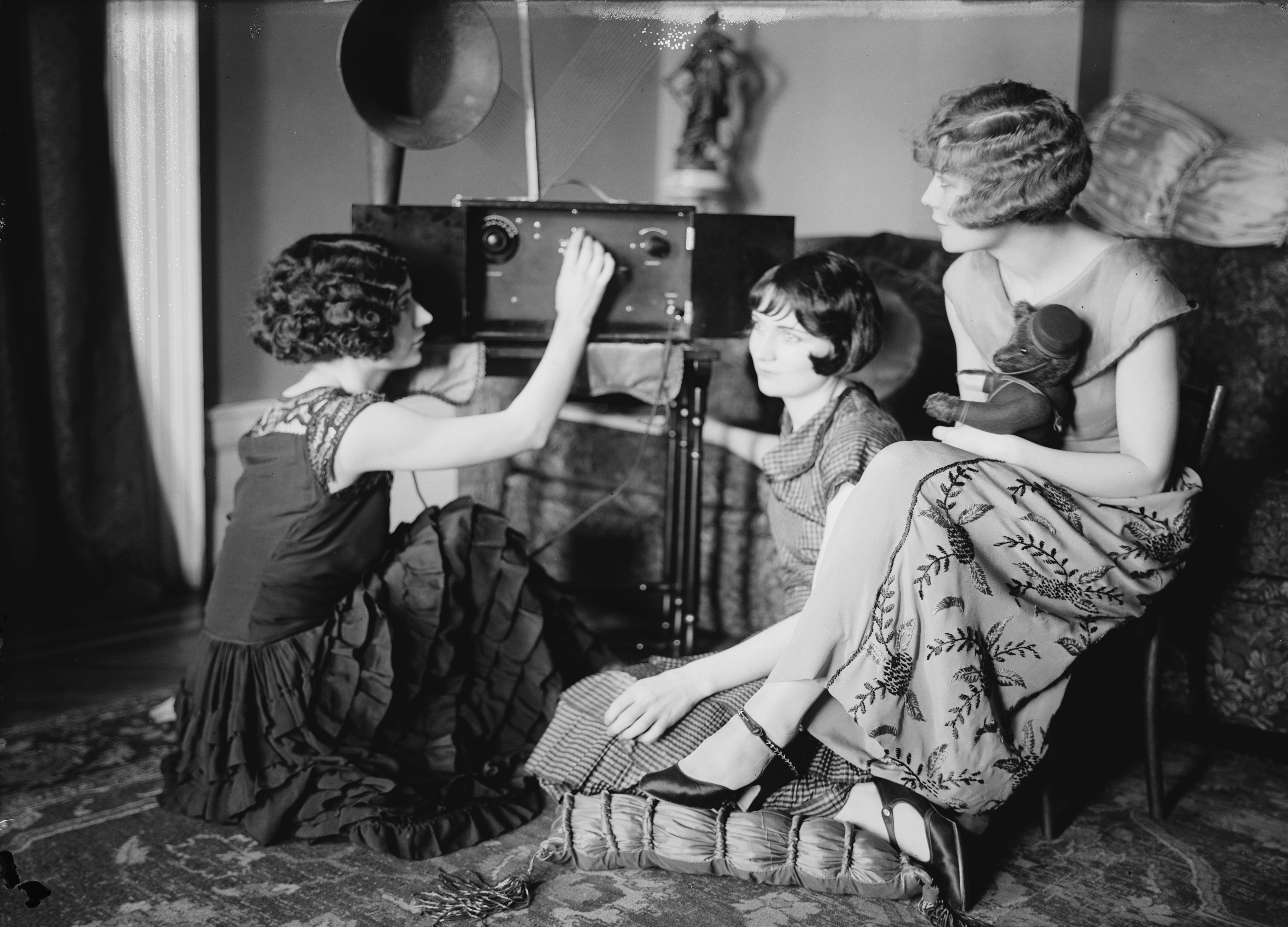 The Brox Sisters, tuning a radio. Left to right, Patricia, Bobbe, Loryane..jpg